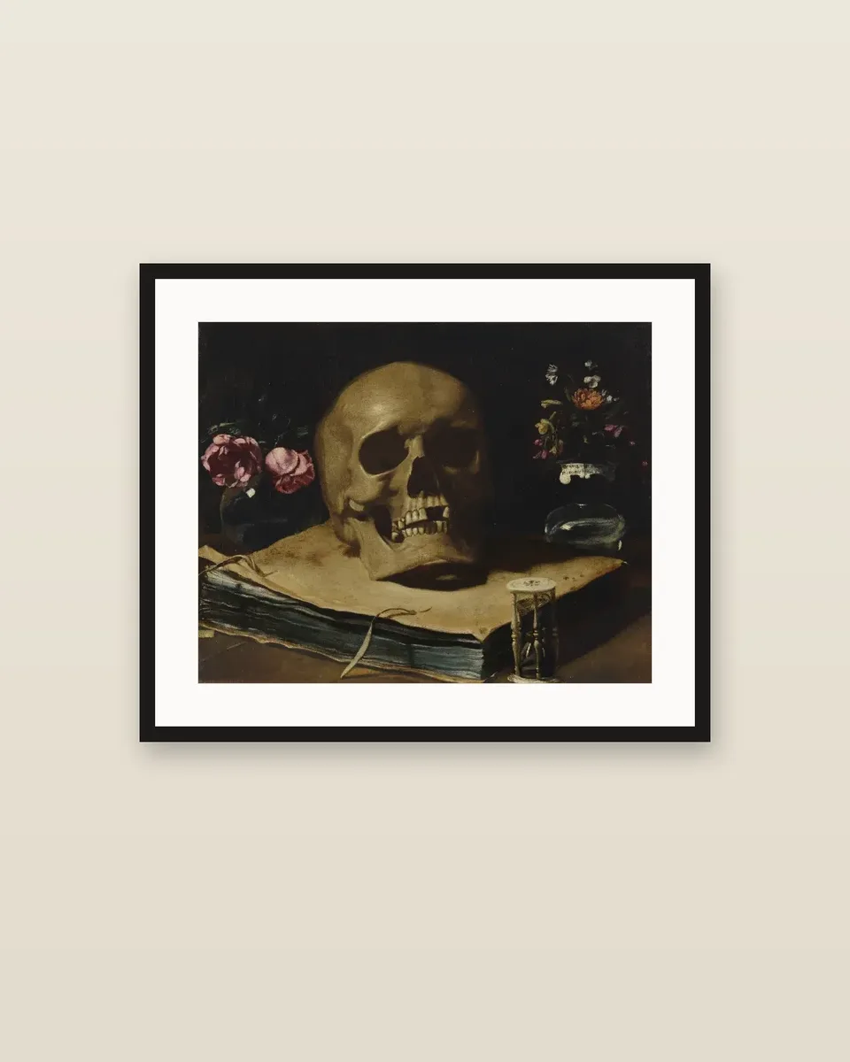 A vanitas still life with a skull atop a book, an hourglass and two glass vases of flowers by Guercino, framed