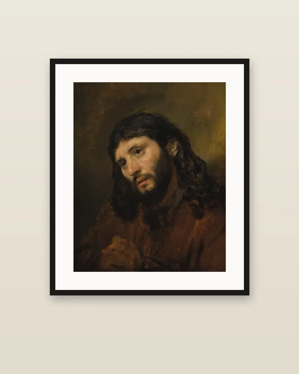 Study of the head and clasped hands of a young man as Christ in prayer by Rembrandt van Rijn, framed