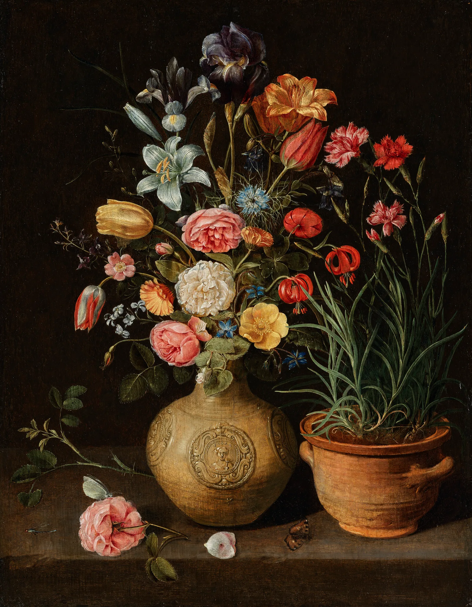 Roses, lilies, an iris and other flowers in an earthenware vase, with a pot of carnations and a butterfly on a ledge, Clara Peeters