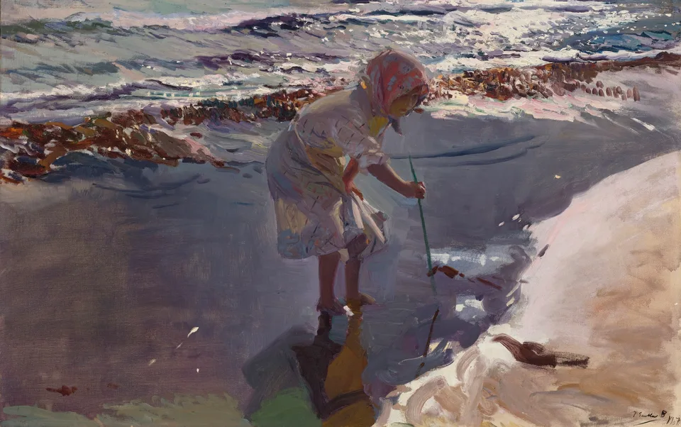A barefoot girl in a plaid dress and kerchief stands in the shallow breaking tide, bending to poke the wet sand for clams while holding her skirt out of the water; the beach has no horizon, boats or other figures.