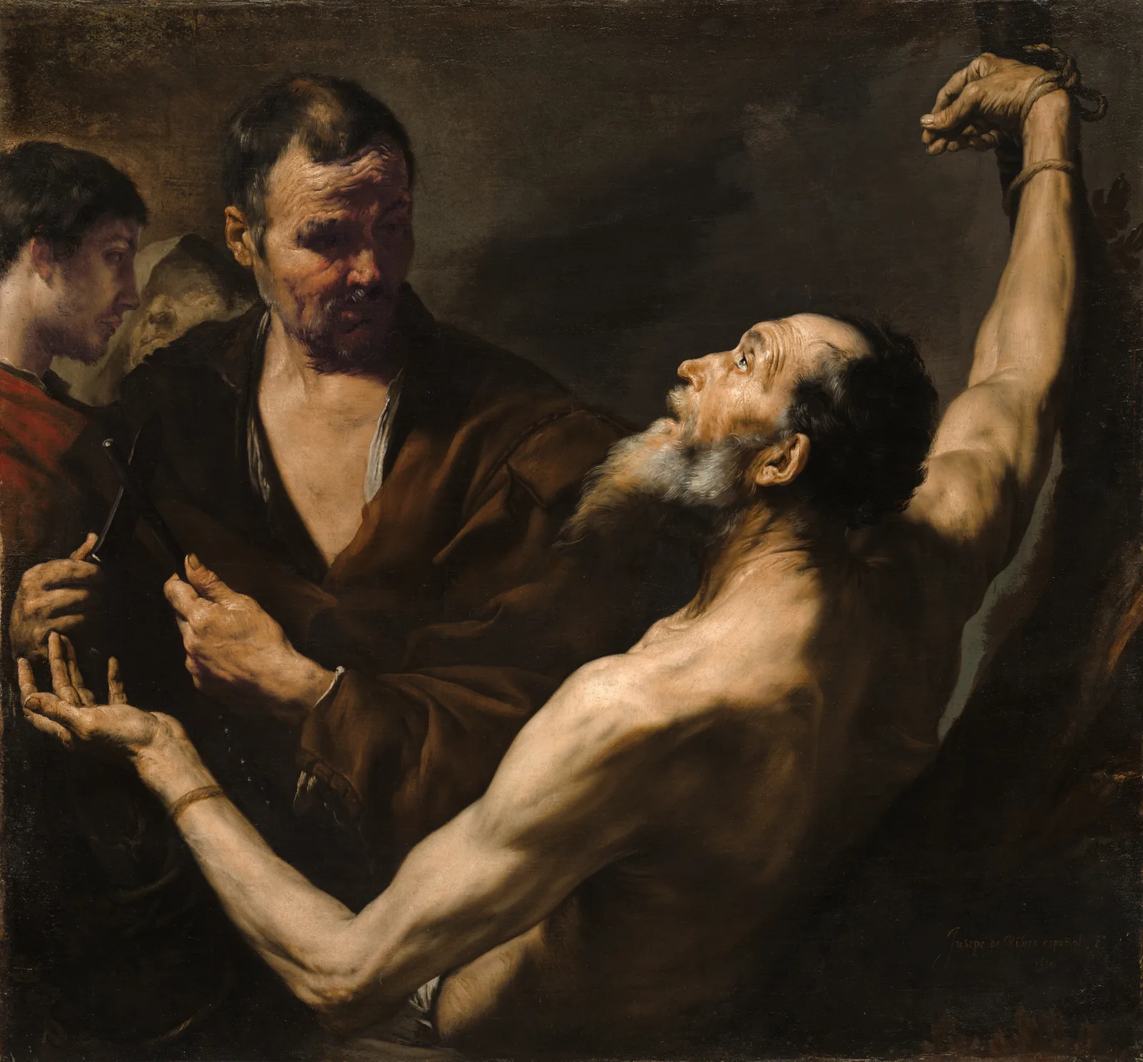 Saint Bartholomew, bare-chested with arms spread wide and face lifted toward a light from the upper left, is surrounded by three men, one holding a knife and a sharpening rod, in deep brown shadow.